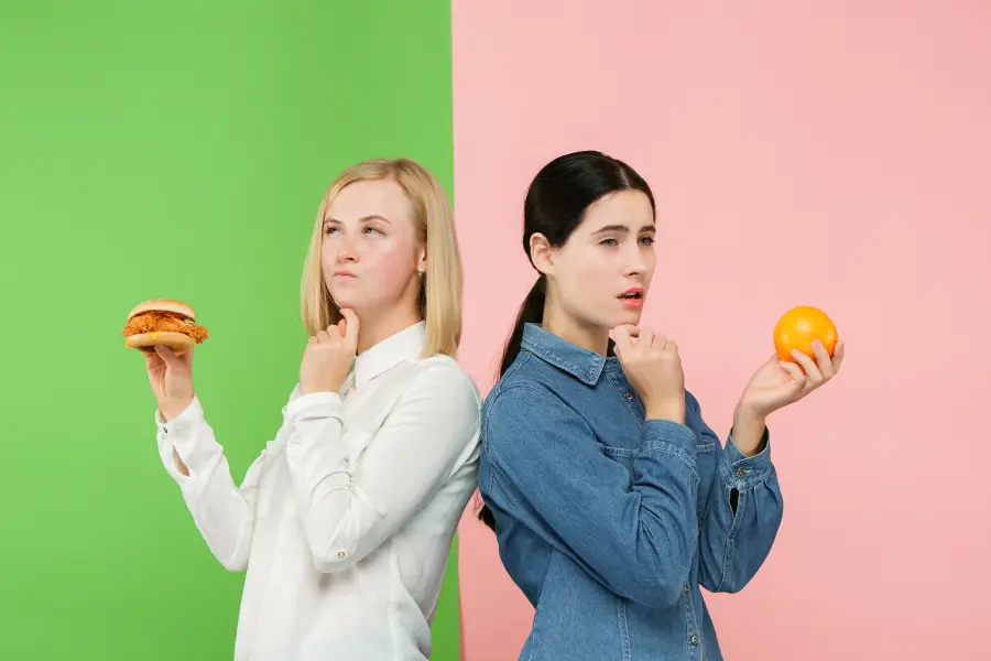 A healthy meal with lean protein, vegetables, and healthy fats, designed for weight loss on Semaglutide, with a doctor advising a patient in the background.